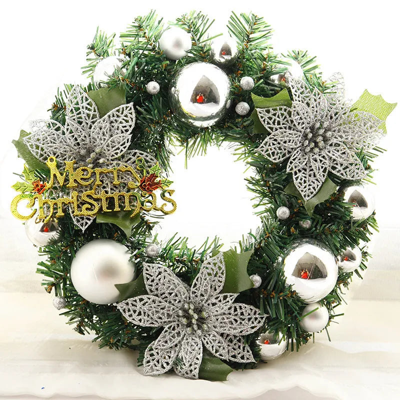 Multicolour plastic Christmas wreath with a 30cm diameter, hung on a door.