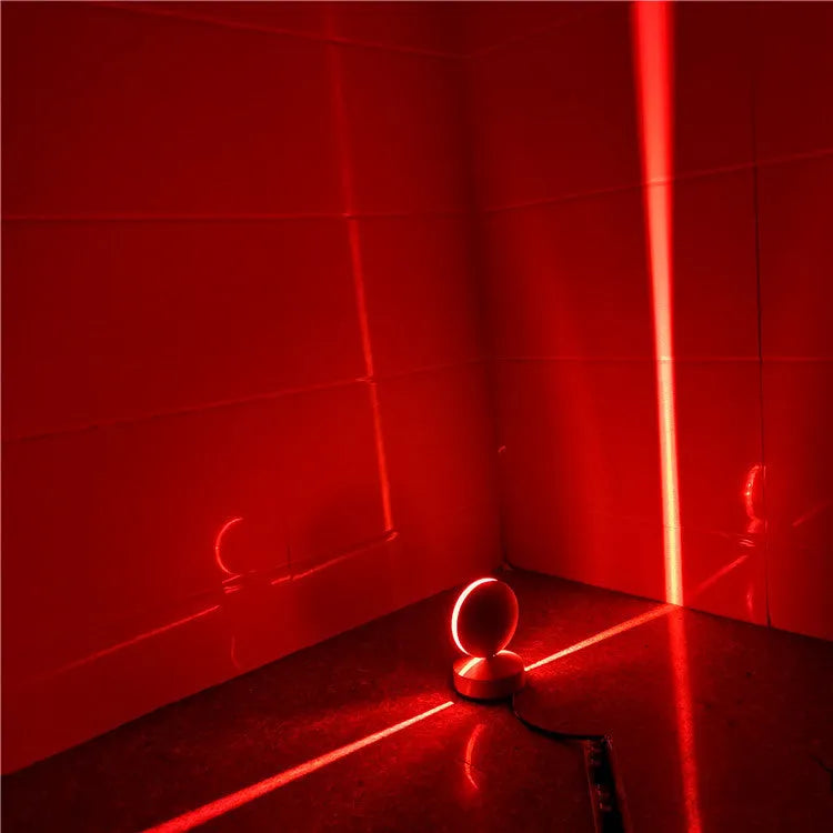 Modern aluminium LED bar wall lamp with glass lens, shown in a corridor setting.