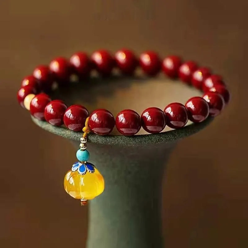 Close-up of a handcrafted wave-shaped cinnabar and copper bead bracelet in national style.
