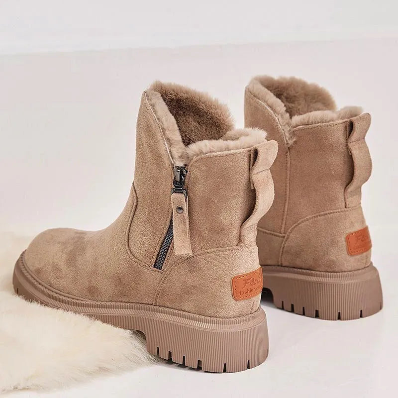Women's black high-top snow boots with side zipper and round toe, made from cow suede.
