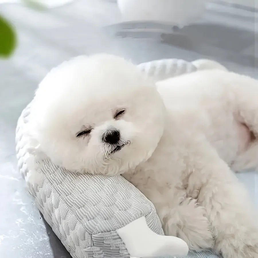 Blue pet bed with big-eyed monster design for dogs and cats, showing non-slip base and breathable fabric.