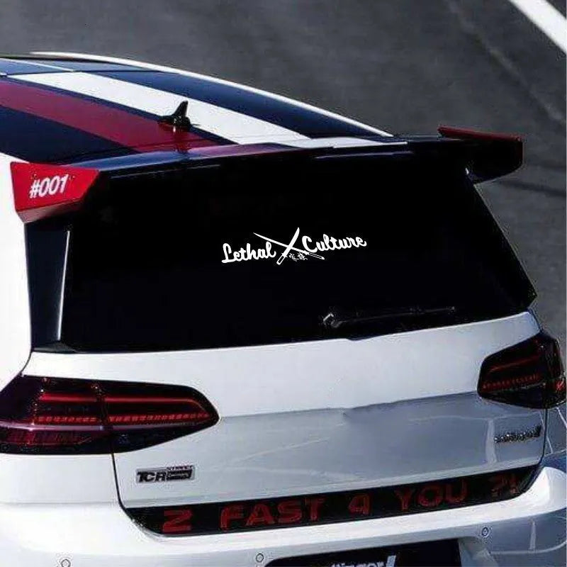 Car rear windshield family sticker showing letters and numbers in yellow or silvery white on automotive glass