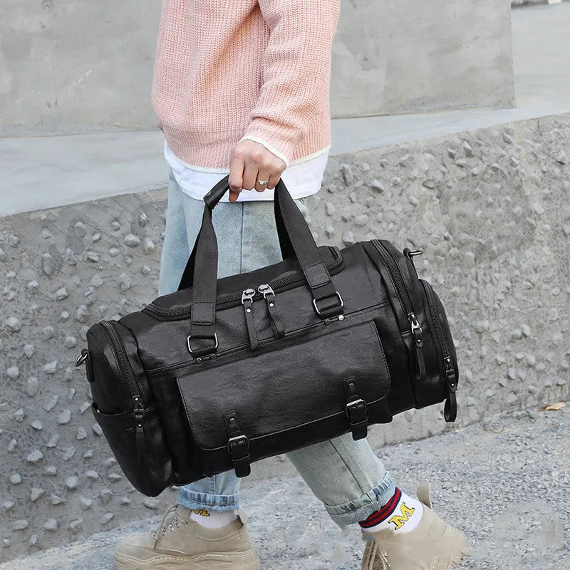 Black PU travel bag with separate shoe compartment measuring 52cm height