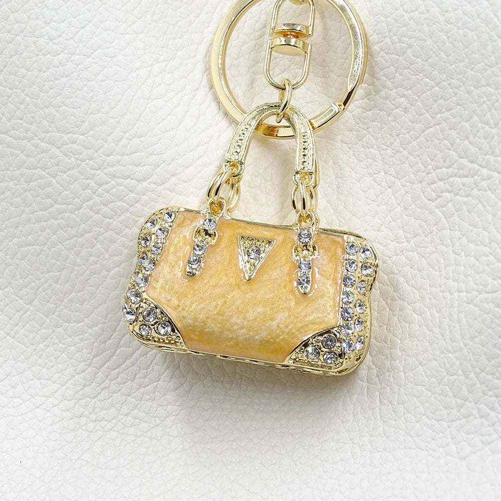 Alloy pendant keychain with enamel diamond cloud pattern in gold colour on keyring
