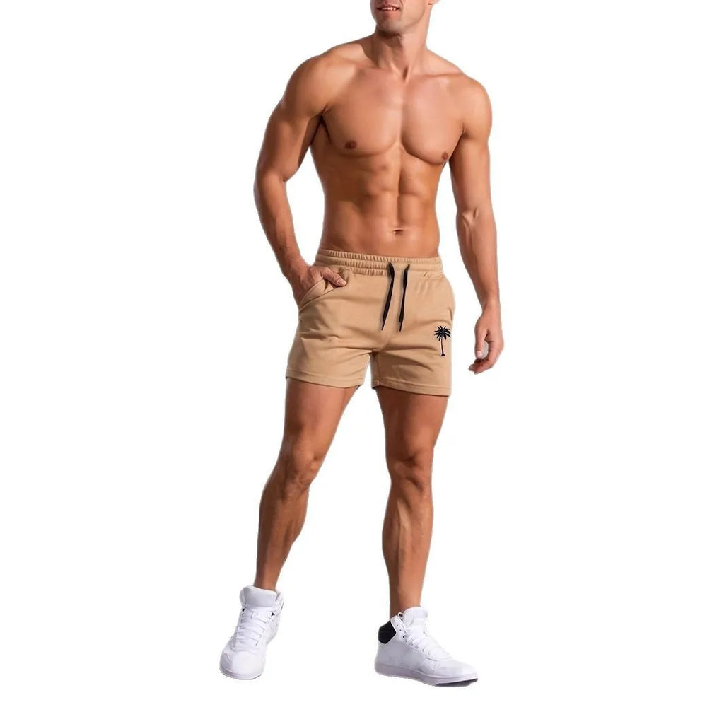 Khaki men's sports shorts with a white coconut leaf print, showing a straight leg and short length.