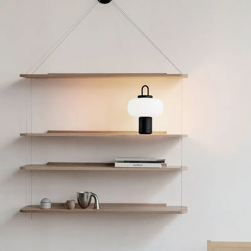 Minimalist Japanese-style glass bedside table lamp for a child's creative bedroom.
