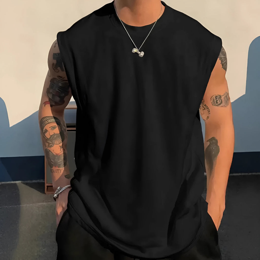 Men's loose fit solid colour cotton tank top shown in a selection of available colours and sizes.