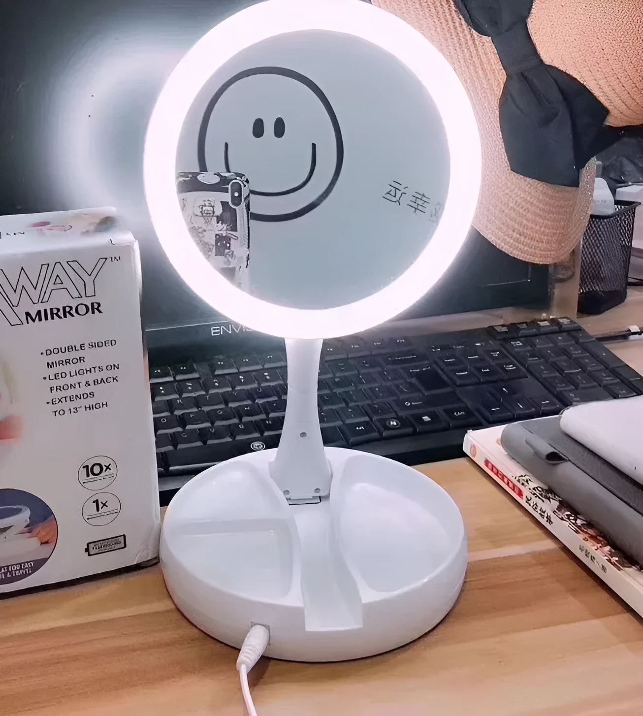 White foldable LED vanity mirror showing 1x and 5x magnification sides and USB charging port.