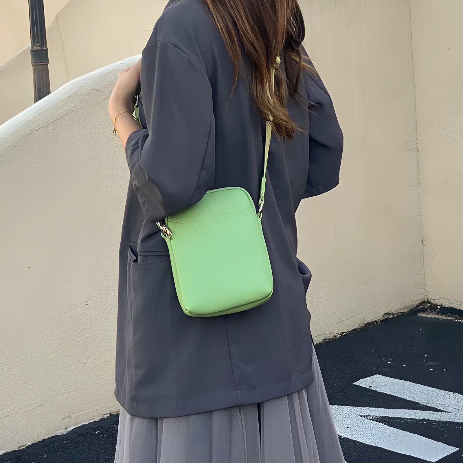 Small solid colour crossbody phone bag for women in beige.