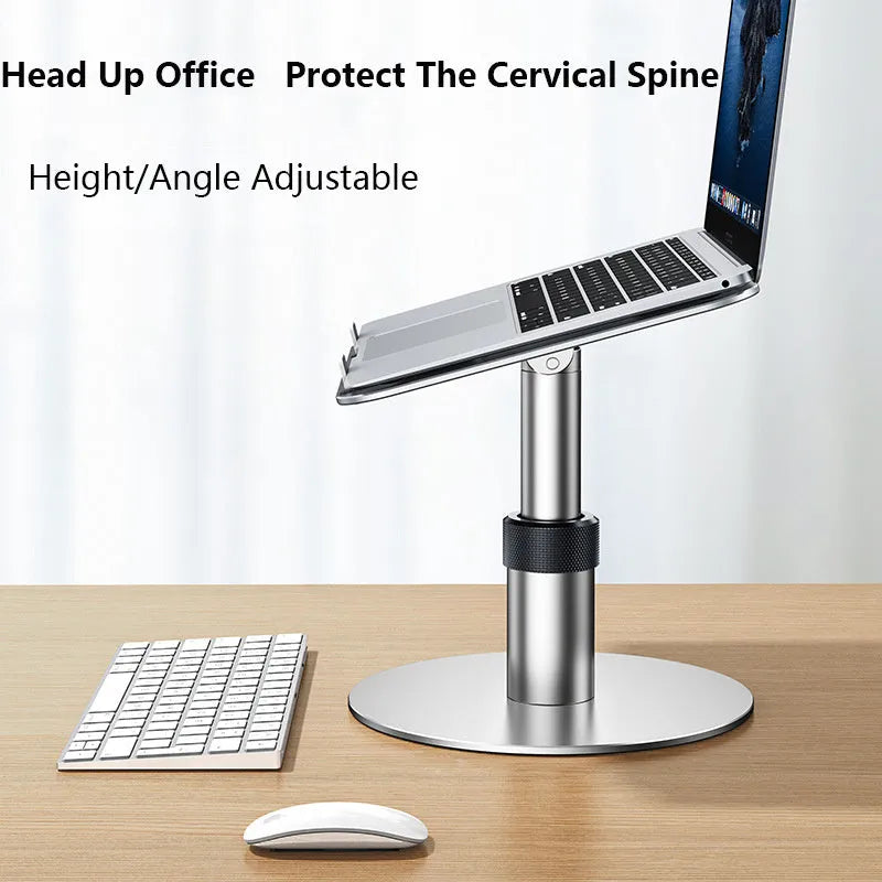Silver aluminium car laptop stand with adjustable height and rotating base on a car seat.