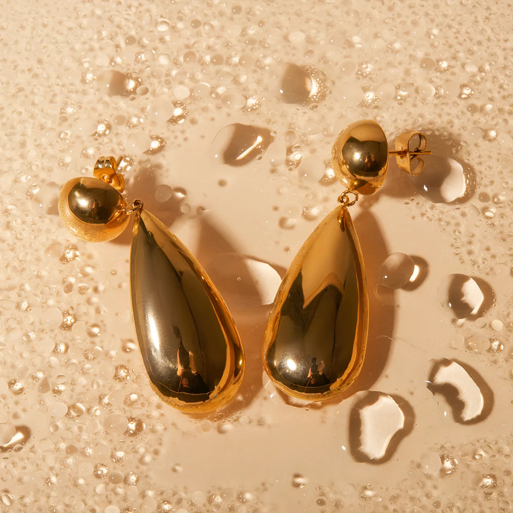 Gold electroplated stainless steel water drop pendant earrings with geometric hemisphere shapes
