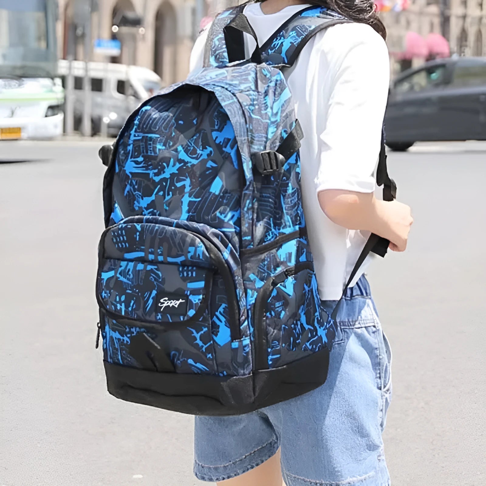 Classic blue nylon backpack with large main compartment and adjustable straps.