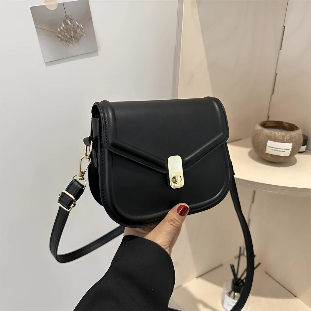 Soft PU leather clamshell messenger bag in a horizontal square shape on a shoulder strap.