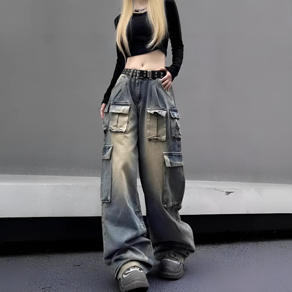 Loose-fit light blue distressed denim jeans with multiple tooling pockets on a straight-leg cut