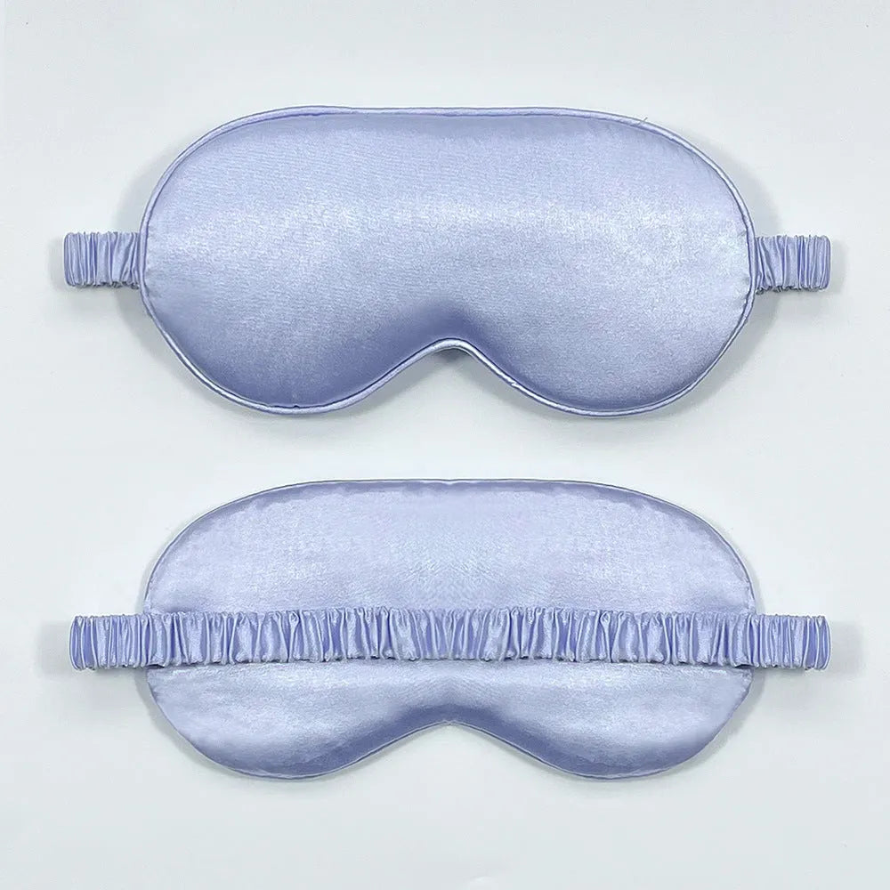 Double-sided silk-like sleep mask in rayon satin, shown in multiple colour options on a white background.