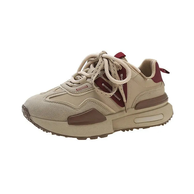 Women's black retro platform sports shoes with round toe and white rubber sole on a plain background.
