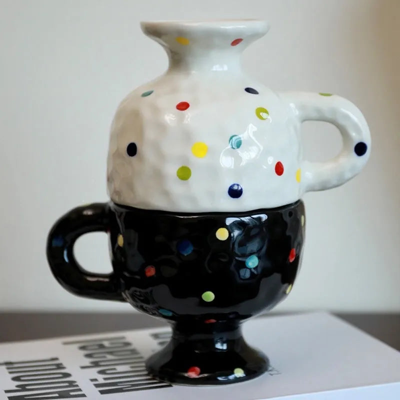 Hand-pinched irregular shaped ceramic mug in a solid colour, modern simple design