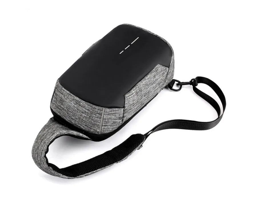 Small dark blue oxford cloth waterproof chest bag with a zipper and car suture detailing.