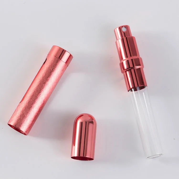 Slender aluminium travel perfume bottle with glass liner in a choice of six colours, shown next to a ruler showing 115mm length.