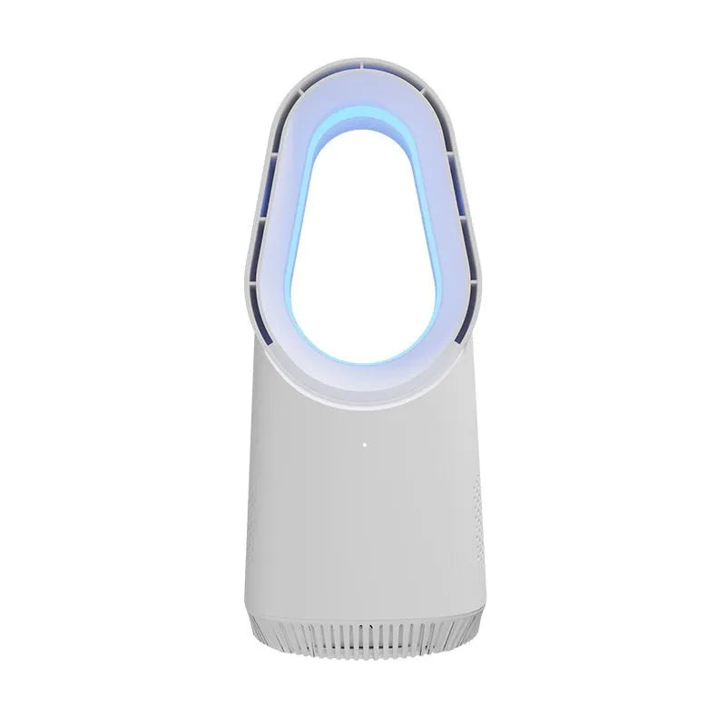 White bladeless tower fan with remote control on a wooden floor next to a desk.