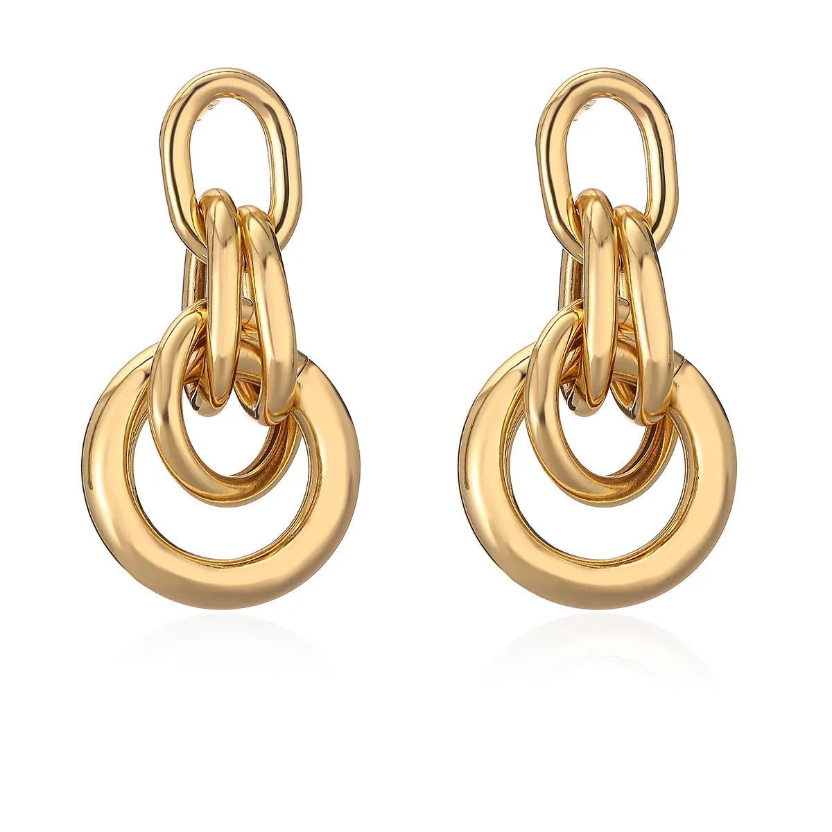 Geometric gold drop earrings with an irregular shape on a copper base.