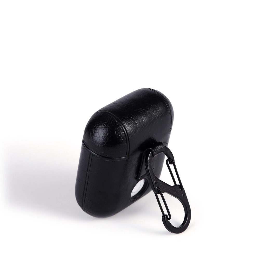 Genuine leather protective pouch for Apple Airpods charging case in black, brown, light brown, and red colours.