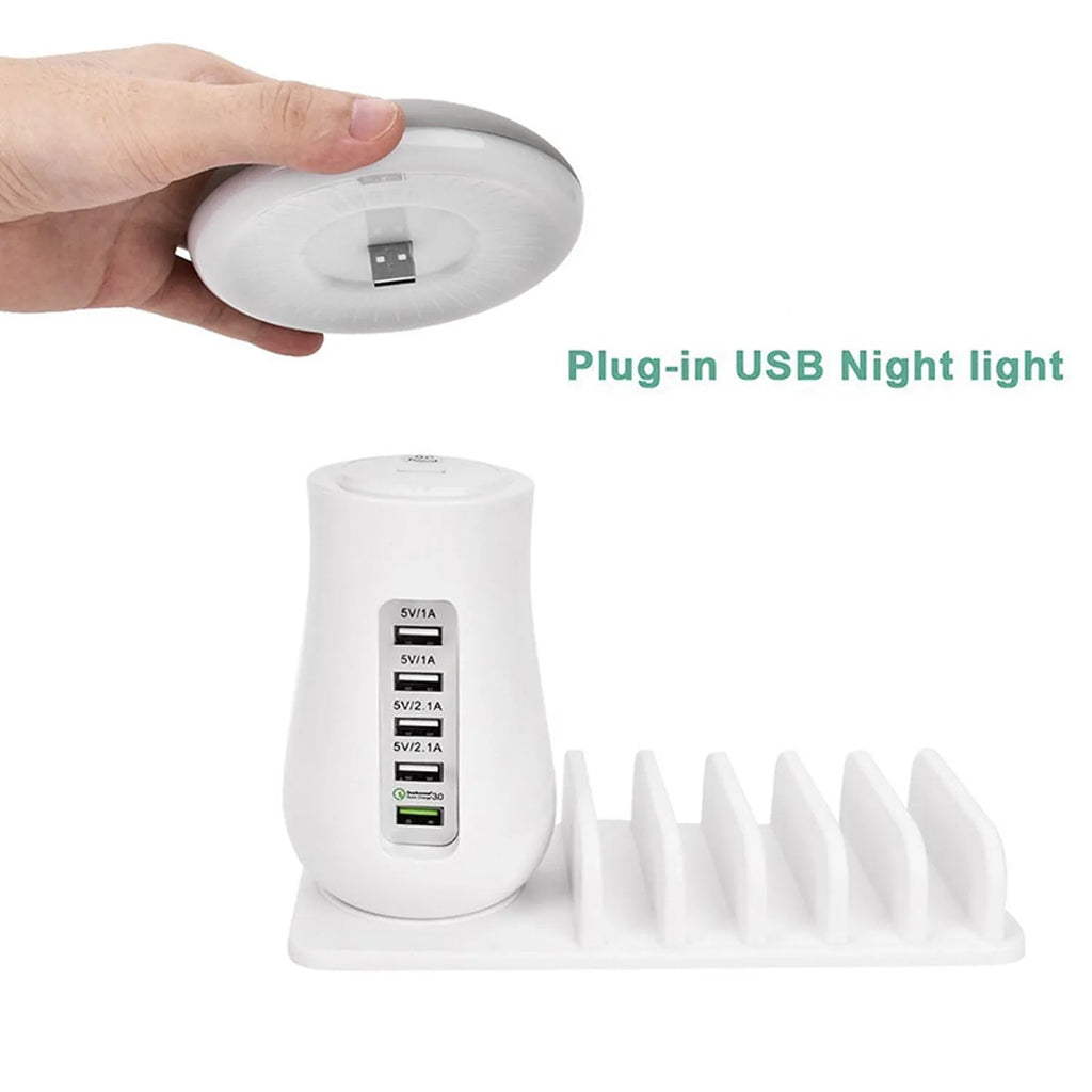 White USB charging dock station with 5 ports and a mushroom-shaped LED night lamp on a desk