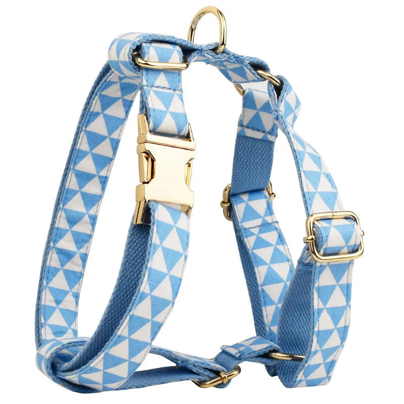 Blue four-piece dog clothing set showing vest, collar, lead and bow accessory in adjustable sizes from XS to XL