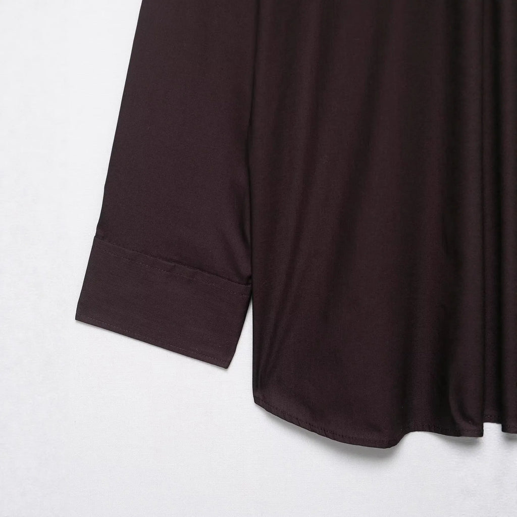 Brown women's loose fit poplin shirt with long sleeves and an integrated bow tie scarf at the neck.