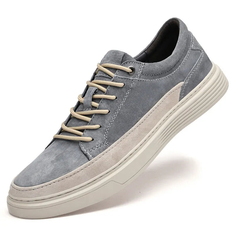 Men's grey casual skate shoes with pigskin upper and rubber sole, shown with front lace-up design and round toe
