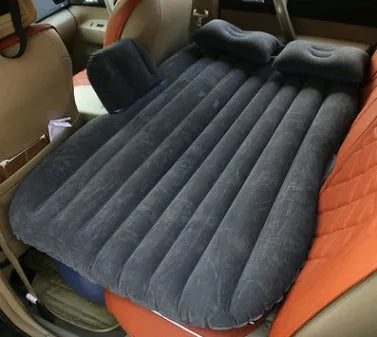 Universal inflatable car bed with flocking material, shown with pump, pillows, and storage bag.