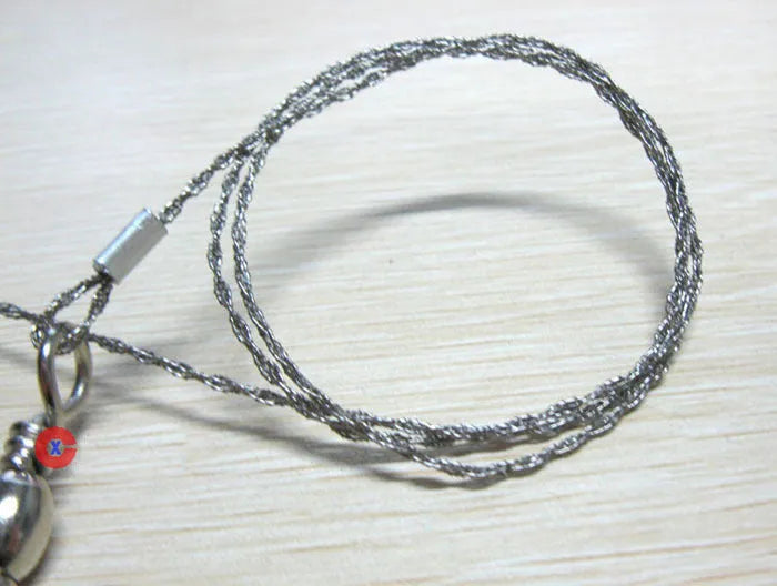 Stainless steel survival wire saw with thumb rings, extended to show its 70cm length.