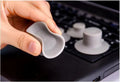 Set of four grey non-slip plastic cooling pads for laptops, shown in two different sizes.