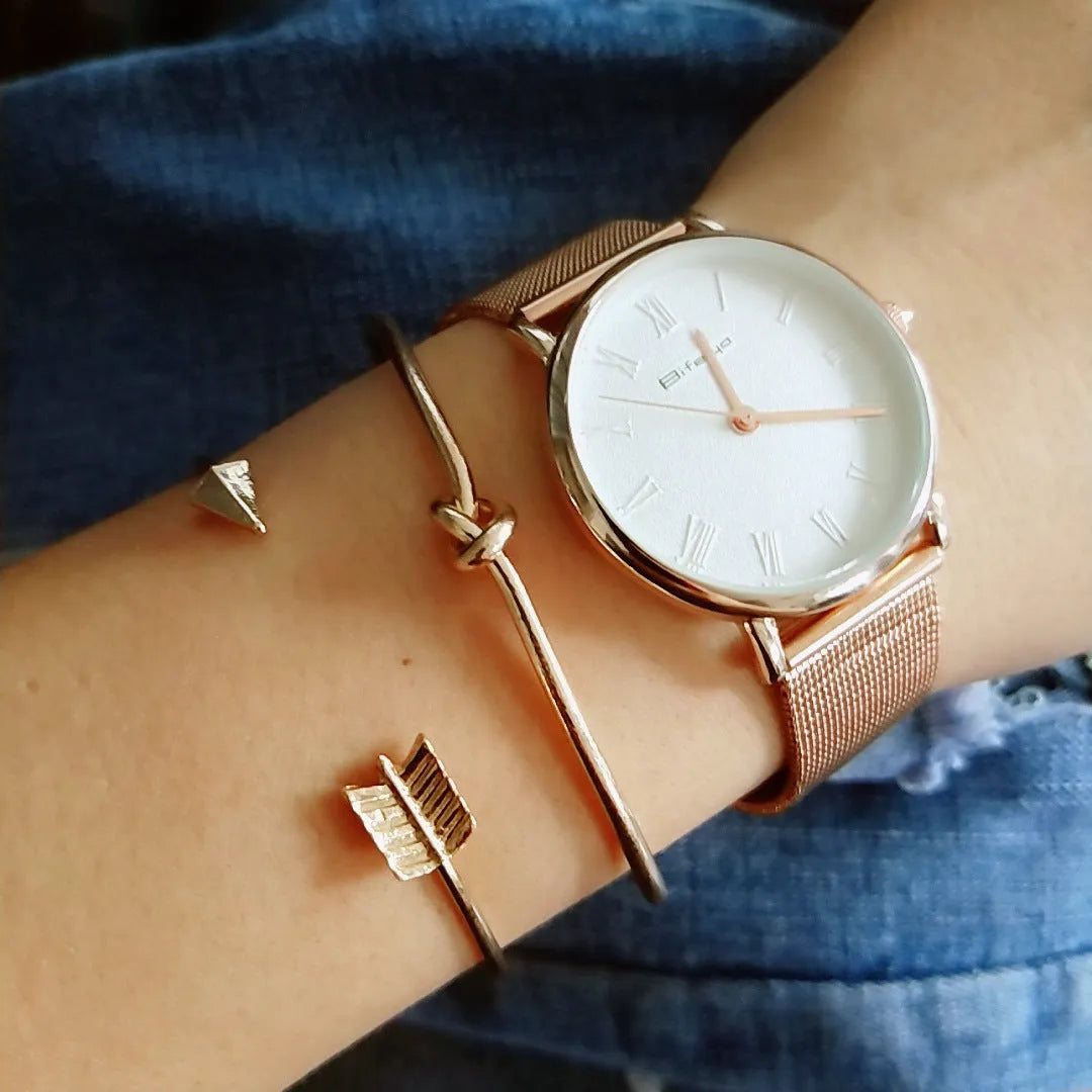 Gold Maili women's vintage cuff bracelet with arrow knot design.