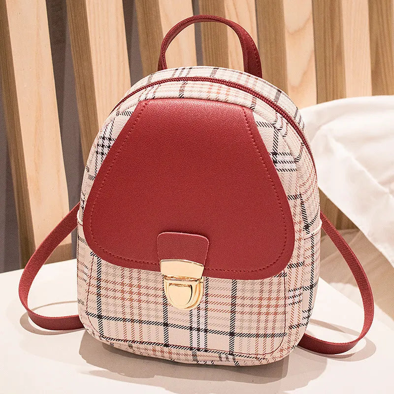Diagonal cut one shoulder phone bag in PU fabric available in five colours.