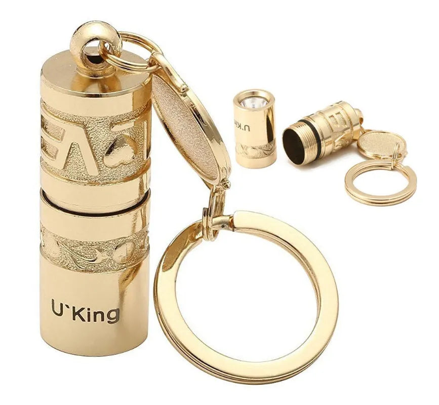 Gold zinc alloy waterproof LED flashlight attached to a key ring
