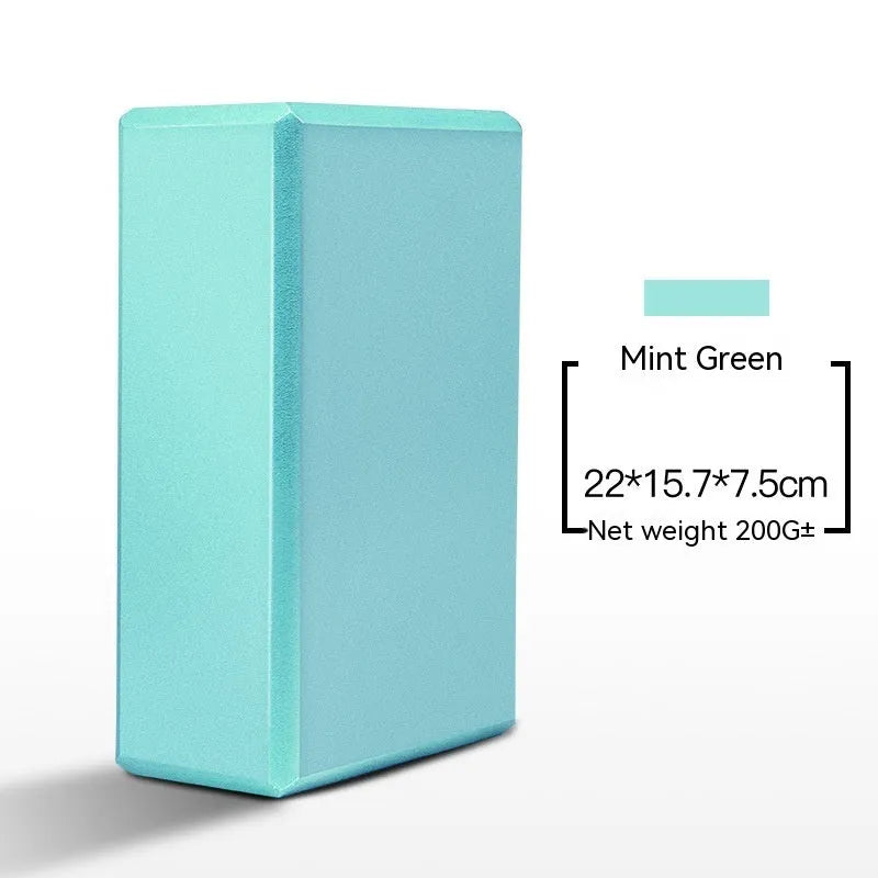 EVA foam yoga block in violet colour, shown next to a pink block, demonstrating its size and rectangular shape for fitness support.