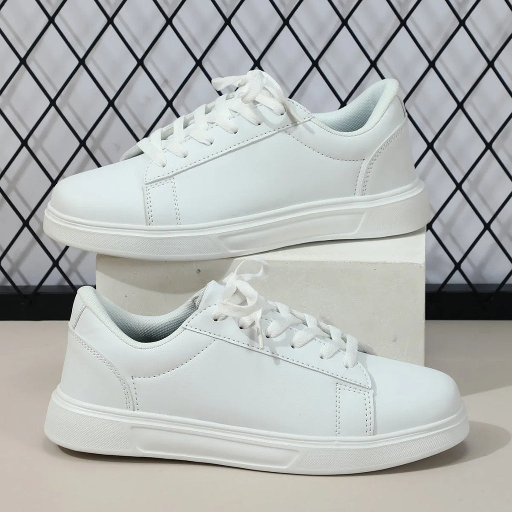 Casual beige brown platform skateboard sneaker with cross strap detail and round toe