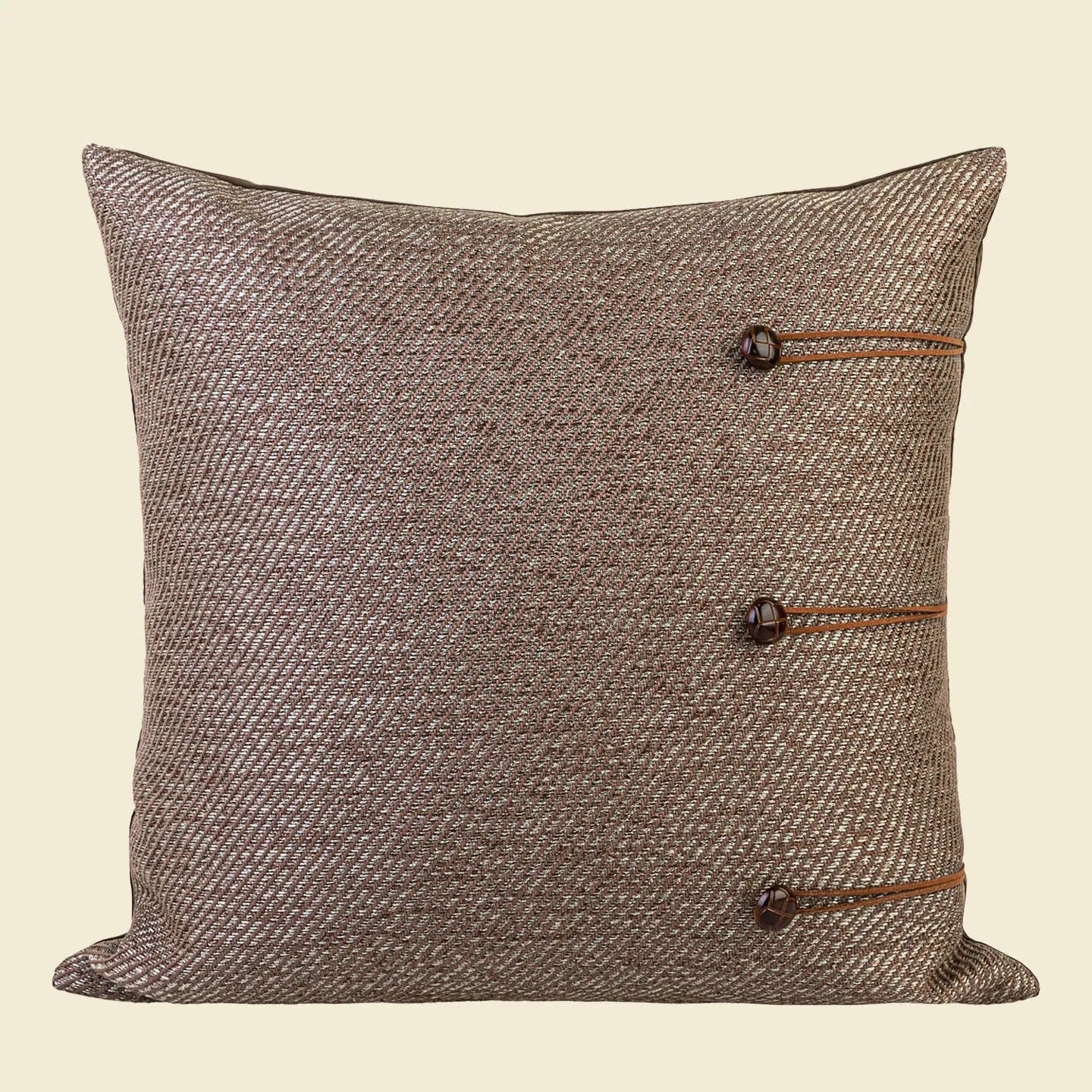 Chinese ancient style square pillow cushion in Maillard colours on a sofa.