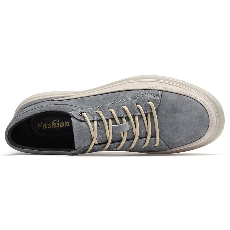 Men's grey casual skate shoes with pigskin upper and rubber sole, shown with front lace-up design and round toe