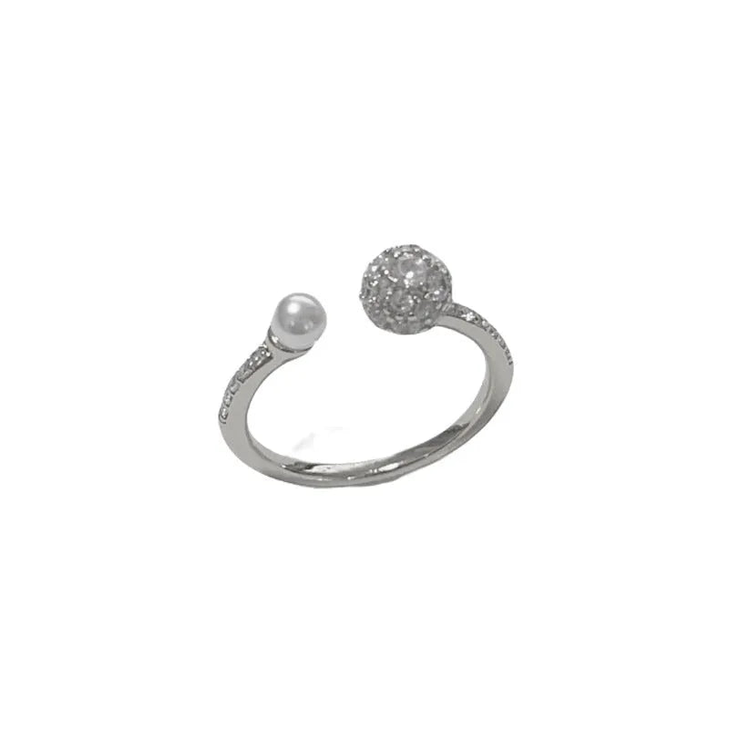 Women's open-end ring with round zircon and pearl detail in gold or silver finish