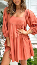 Girl in a light blue square collar puff sleeve backless A-line summer dress.