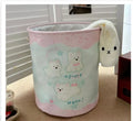 Foldable cotton cloth laundry basket in a character print colour, shown unfolded for use.