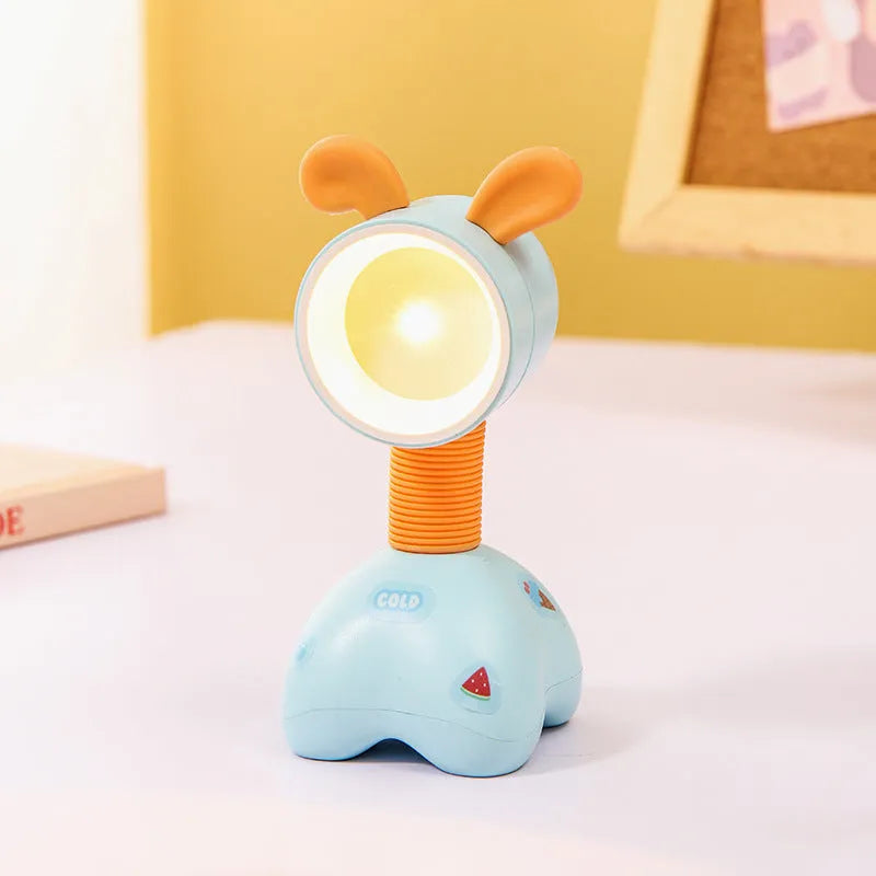DIY magnetic cartoon small night lamp with multi-angle adjustable lighting on desktop