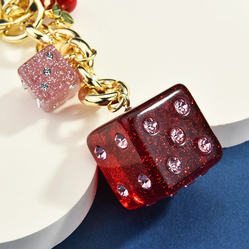 Square metal keychain pendant with a vintage cherry two-tone dice pattern for luggage or bags.