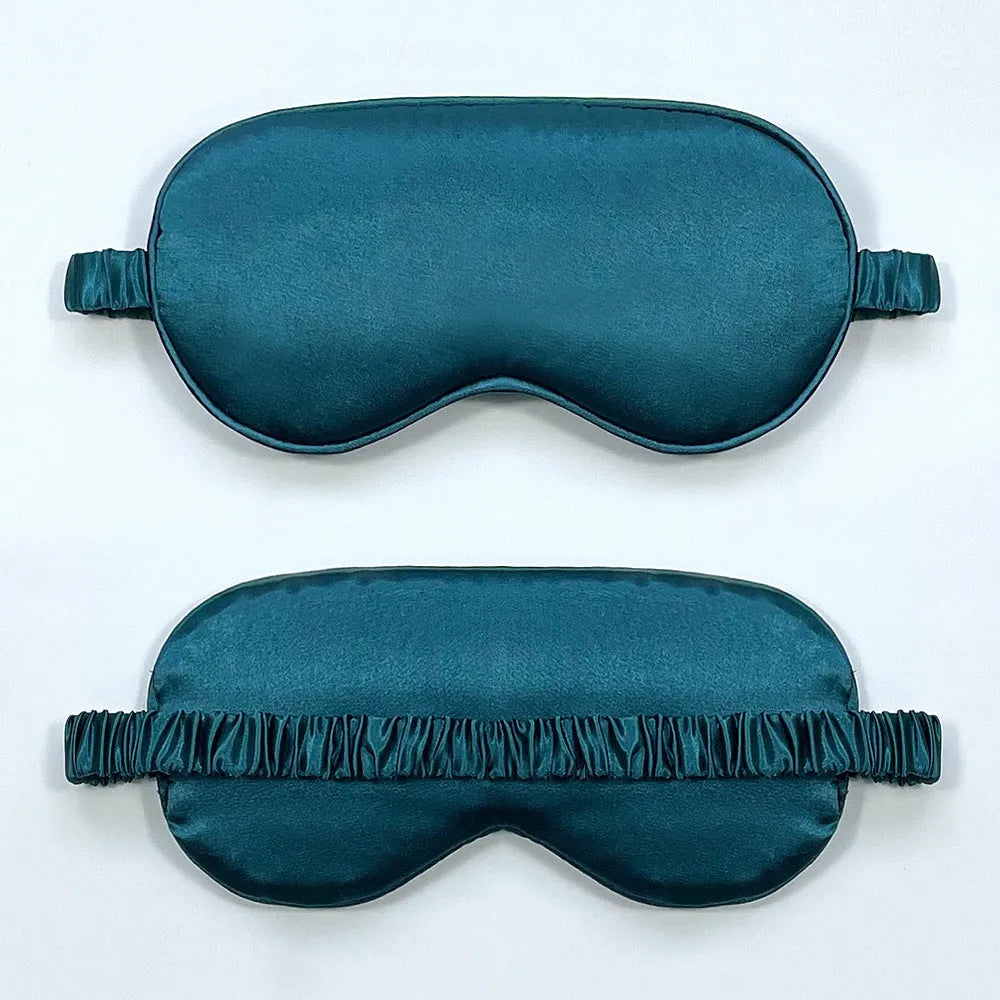 Double-sided silk-like sleep mask in rayon satin, shown in multiple colour options on a white background.