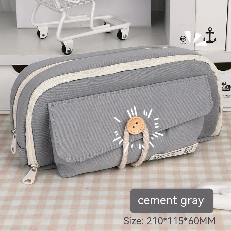 Korean-style canvas pencil case in green, beige, blue or grey holding multiple pens