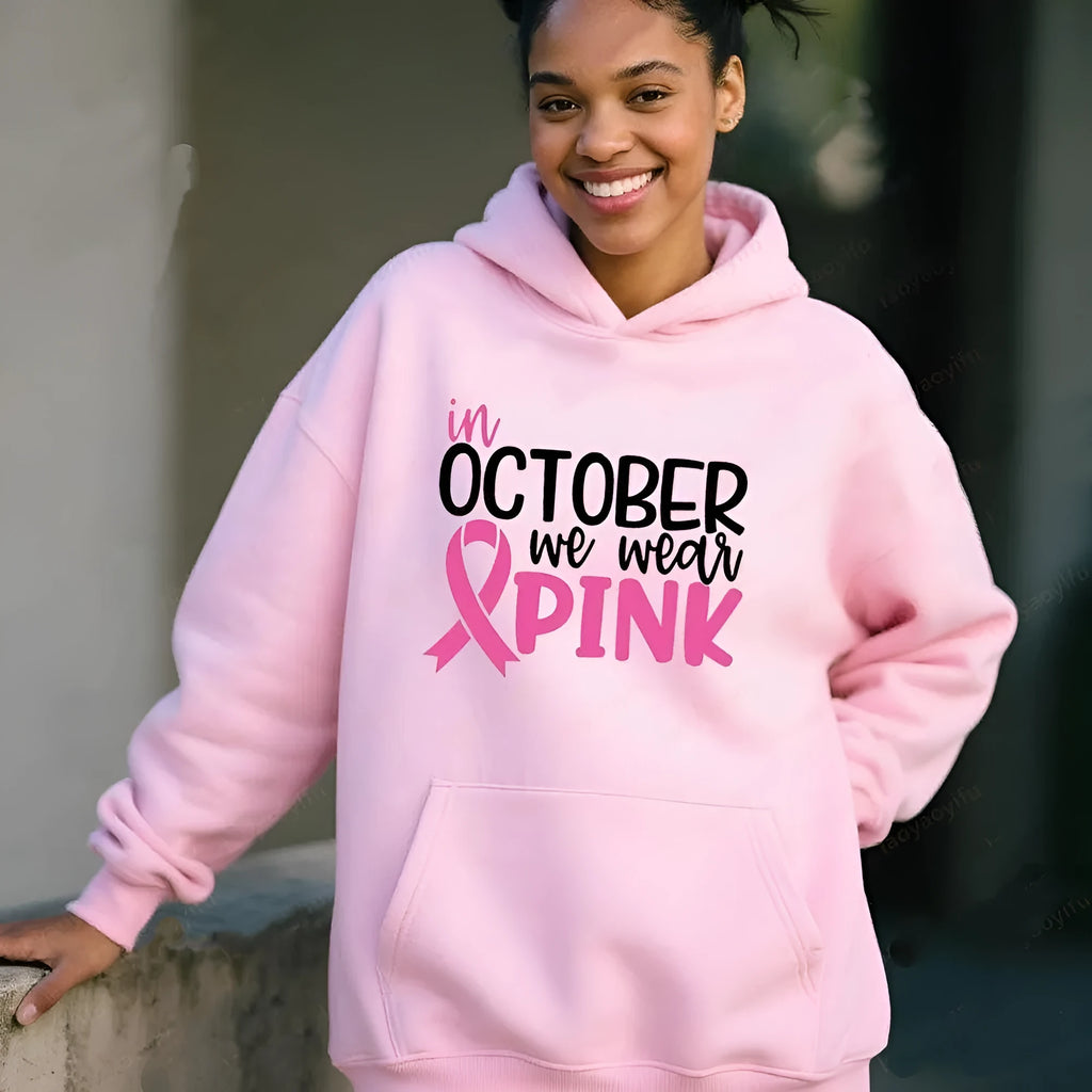 Women's pink graphic sweatshirt hoodie with 'I'm A Survivor' slogan and art retro pattern print.