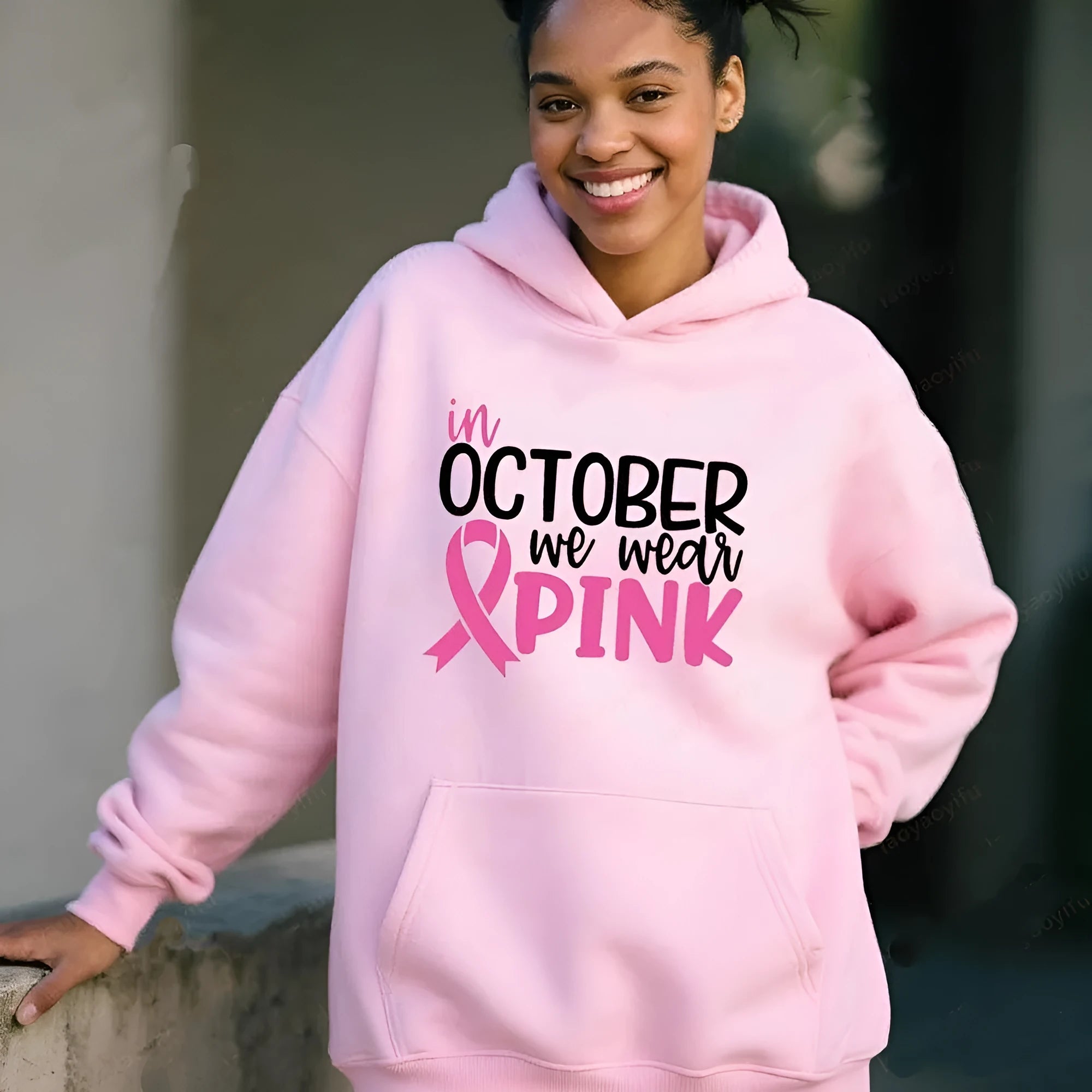Women's pink graphic sweatshirt hoodie with 'I'm A Survivor' slogan and art retro pattern print.