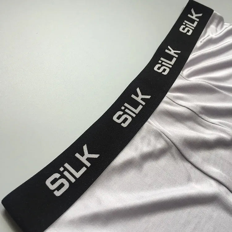 Men's loose fit silk shorts in navy blue, silver grey, or skin colour with mid-waist design